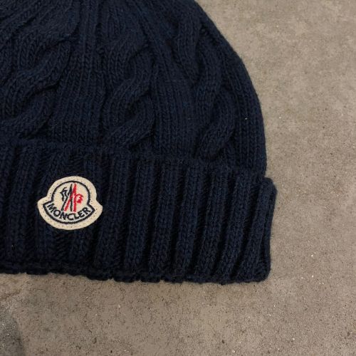 muts cable-knit met logo