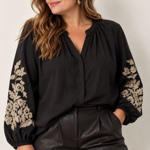 blouse met broderie op de mouw